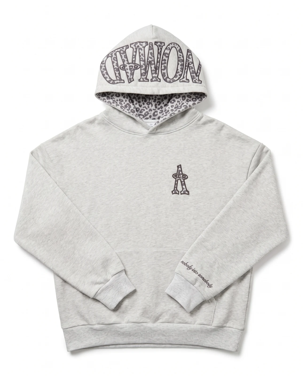 The Ash Heather Hoodie, front. NOMAD across the hood in snow leopard, halo A on the chest.